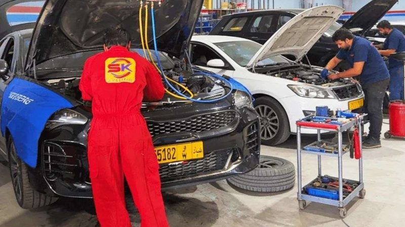 A Sial Kingdom technician working on a car engine in Muscat.